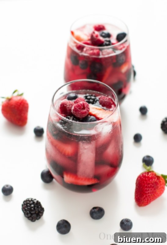 Summer Berry Moscato Sangria pitcher and glasses ready to serve