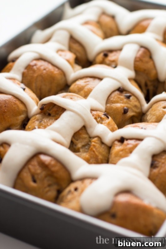Platter of freshly baked Chocolate Chip Hot Cross Buns