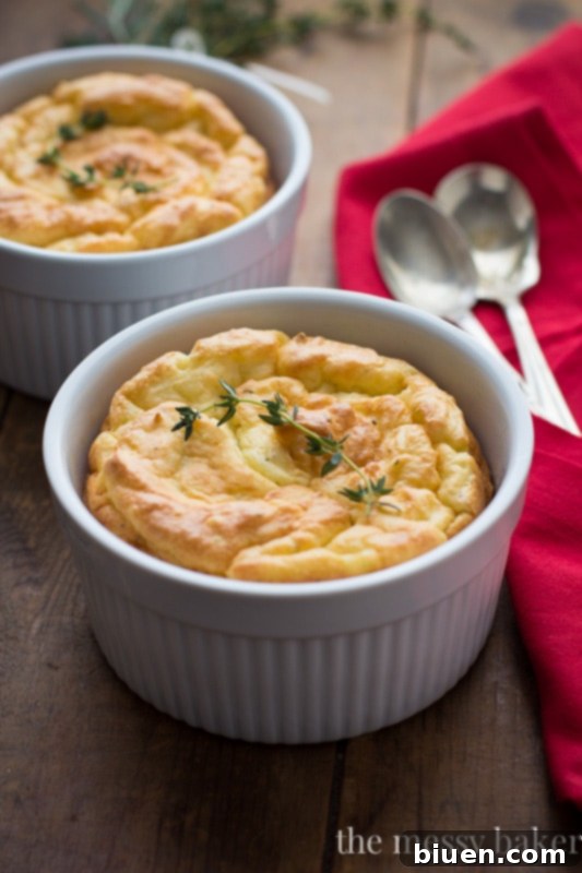 Golden brown Herb & Cheese Potato Soufflés in ramekins, a perfect holiday side dish