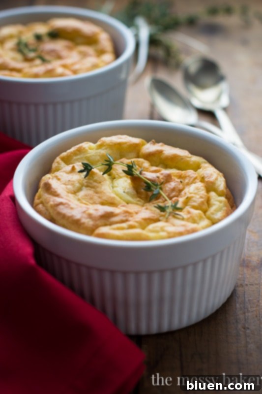 Close-up of fluffy Herb & Cheese Potato Soufflés, showing the airy texture and melted cheese
