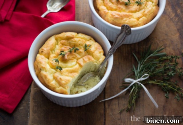 Serving dish of golden brown Herb & Cheese Potato Soufflés, ready to enjoy