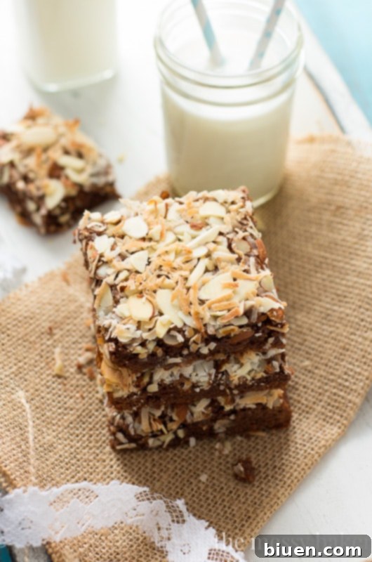 Freshly baked Almond Joy brownies cooling on a wire rack, showing their fudgy texture