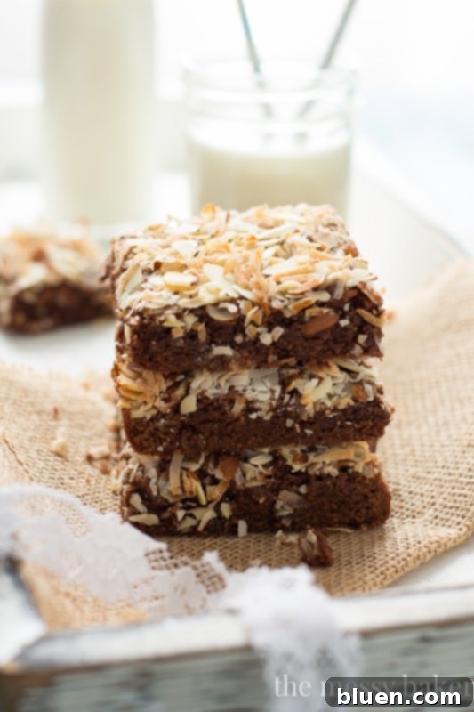 Individual Almond Joy brownie square with toasted coconut and sliced almonds