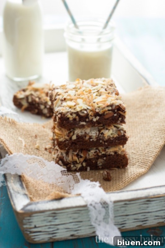Ingredients for Almond Joy brownies including coconut oil, dark chocolate, and almonds