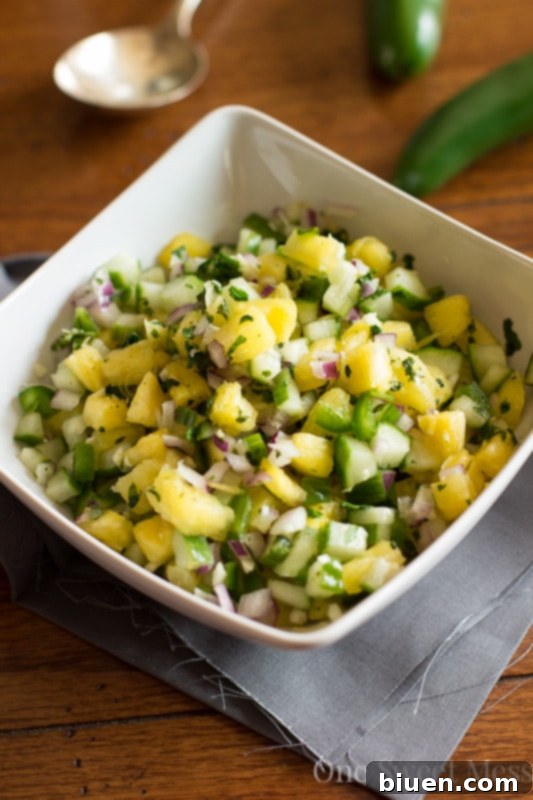 Close-up of Pineapple Cucumber Salsa with tortilla chips