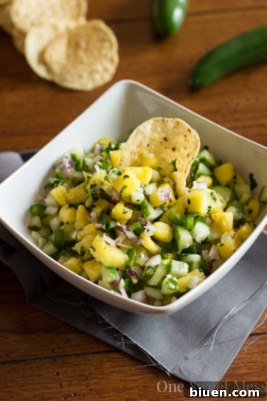 Ingredients for Pineapple Cucumber Salsa in separate bowls