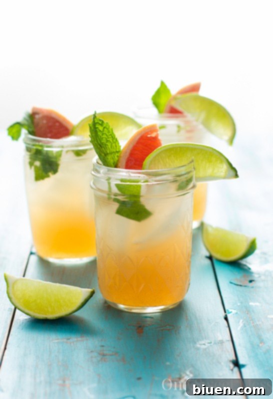 Ingredients for a Grapefruit Honey Mojito being muddled.