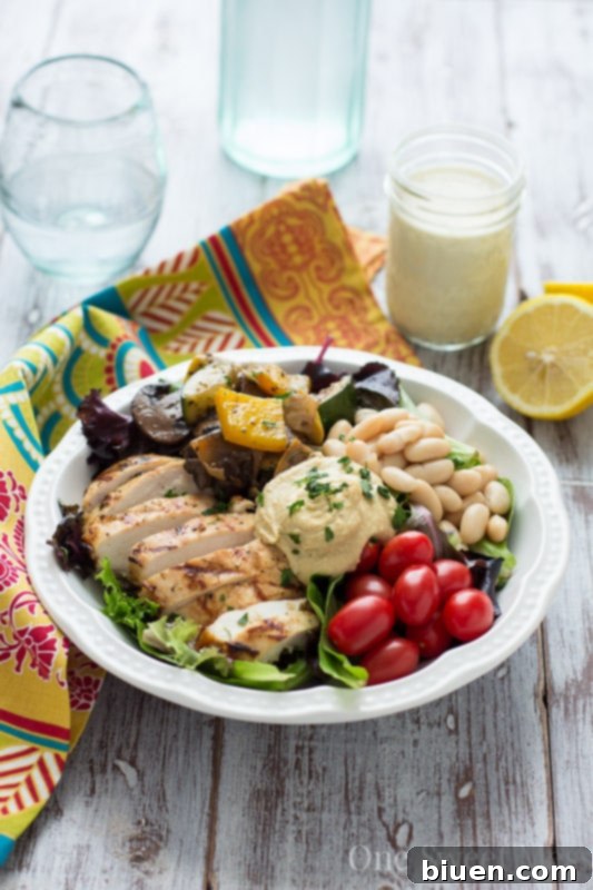 Mediterranean Chicken & Grilled Veggie Salad with Hummus and Lemon Tahini Dressing