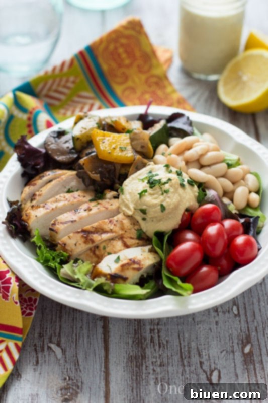Mediterranean Chicken & Grilled Veggie Salad with Hummus and Lemon Tahini Dressing