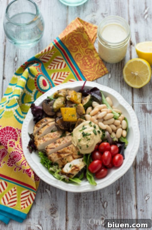 Mediterranean Chicken & Grilled Veggie Salad with Hummus and Lemon Tahini Dressing