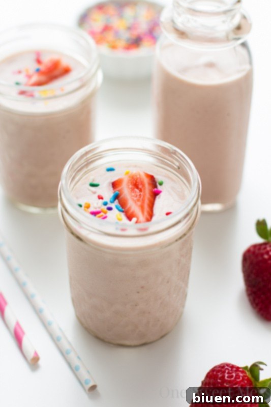 Refreshing Strawberry-Banana Cake Batter Smoothie in a glass, ready to drink
