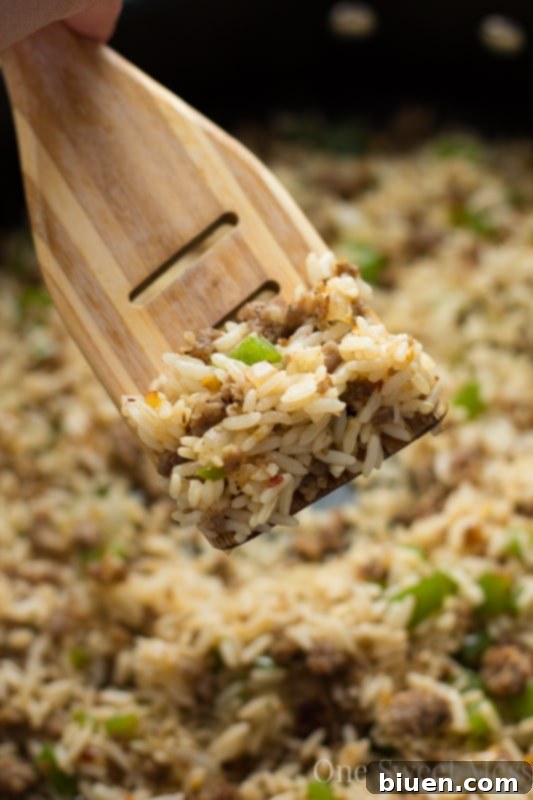 Louisiana's Hearty Dirty Rice 4 Dirty Rice cooking in a pan