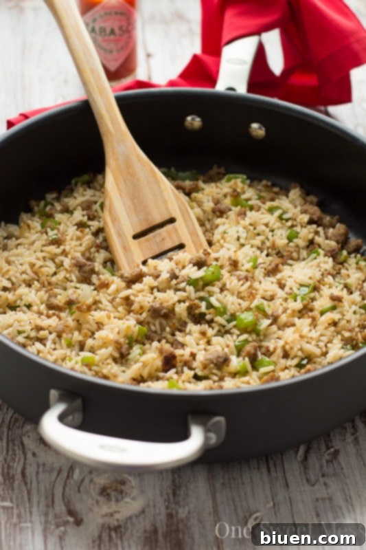 Louisiana's Hearty Dirty Rice 6 Dirty Rice with a spoon