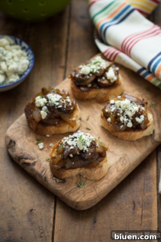 Caramelized Onion & Mushroom Crostini with Blue Cheese Crumbles