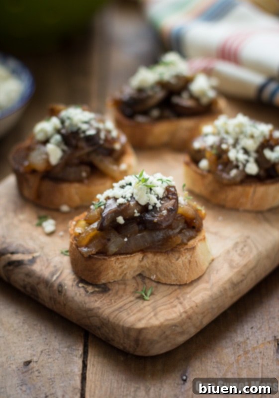 Caramelized Onion & Mushroom Crostini with Blue Cheese Crumbles