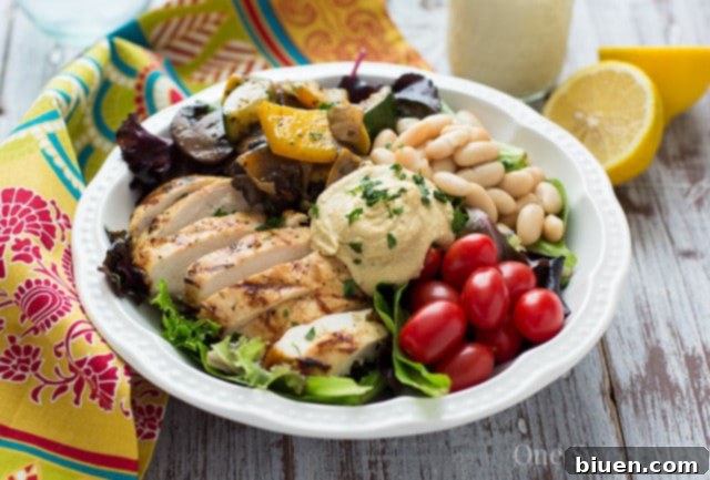 Mediterranean Chicken & Grilled Veggie Salad with Hummus and Lemon Tahini Dressing