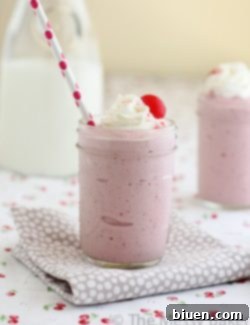 A glass of Strawberry Basil Milkshake, featured on the recipe card for easy viewing.