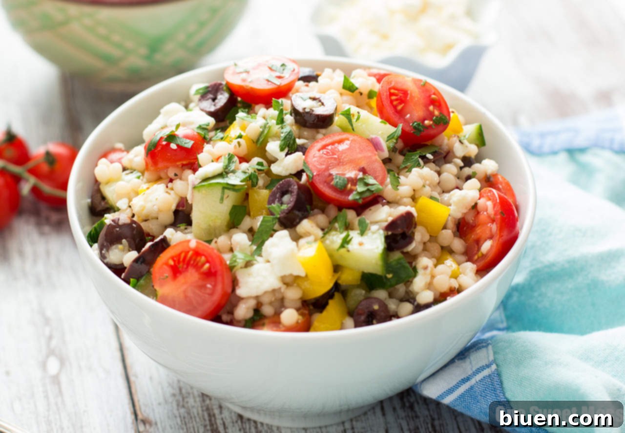 Close-up of Greek Israeli Couscous Salad with feta and olives