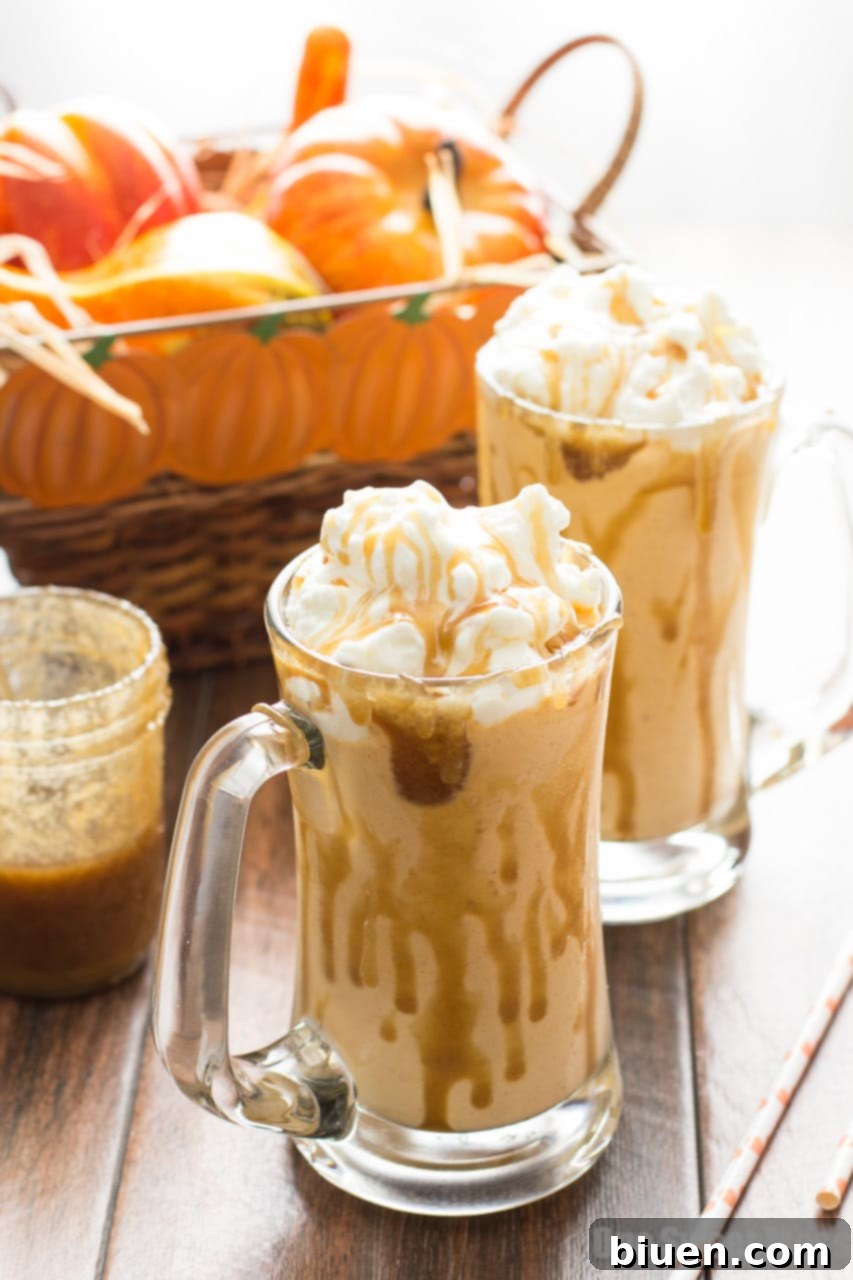 Creamy Caramel Pumpkin Pie Milkshake topped with whipped cream and caramel drizzle, served in a tall glass