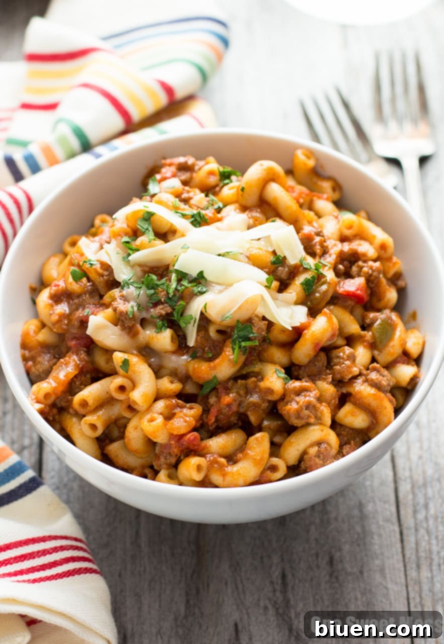 One Pot Chili Mac | Tender beef, gooey cheese, and pasta in one easy weeknight dish.