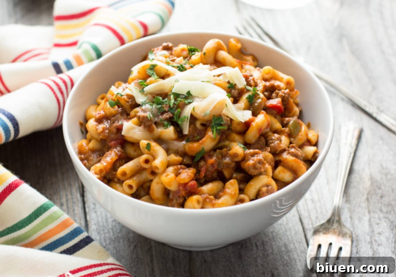One Pot Chili Mac | Tender beef, gooey cheese, and pasta in one easy weeknight dish.