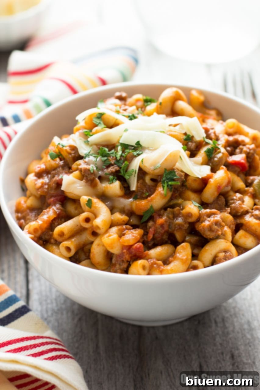One Pot Chili Mac | Tender beef, gooey cheese, and pasta in one easy weeknight dish.