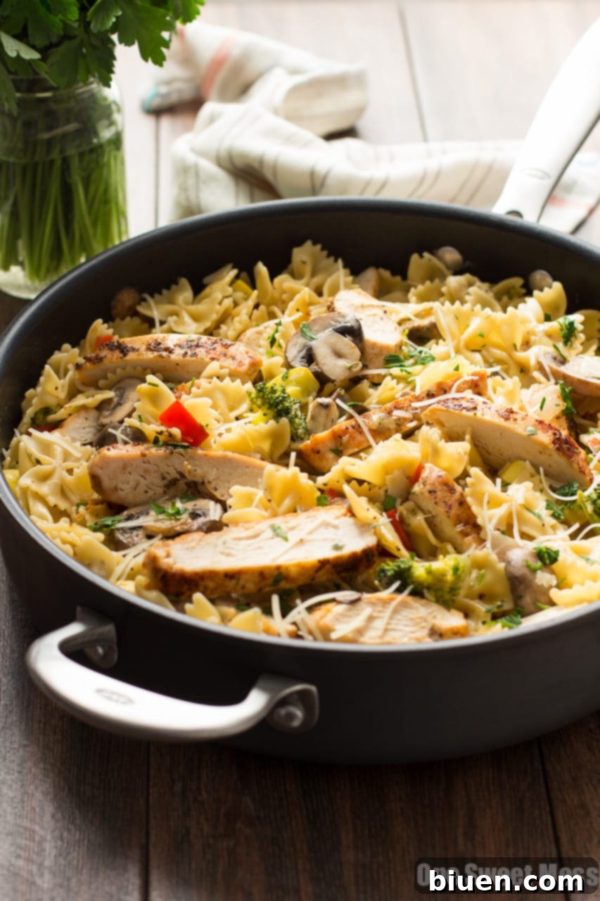 Chicken Alfredo Primavera ingredients laid out: Fresh ingredients for Chicken Alfredo Primavera, including uncooked chicken, various vegetables, pasta, and spices, demonstrating the quality and simplicity of the components before cooking.