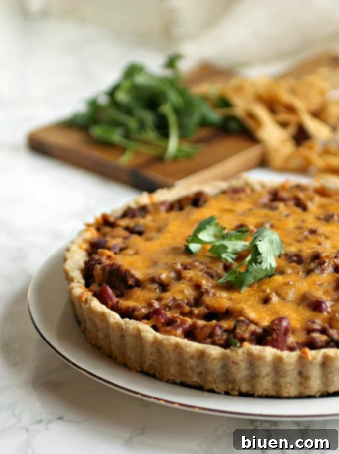 New York Frito Pie - a hearty and customizable dish featuring chili, Fritos corn chips, and melted cheese, great for a fun weeknight dinner.