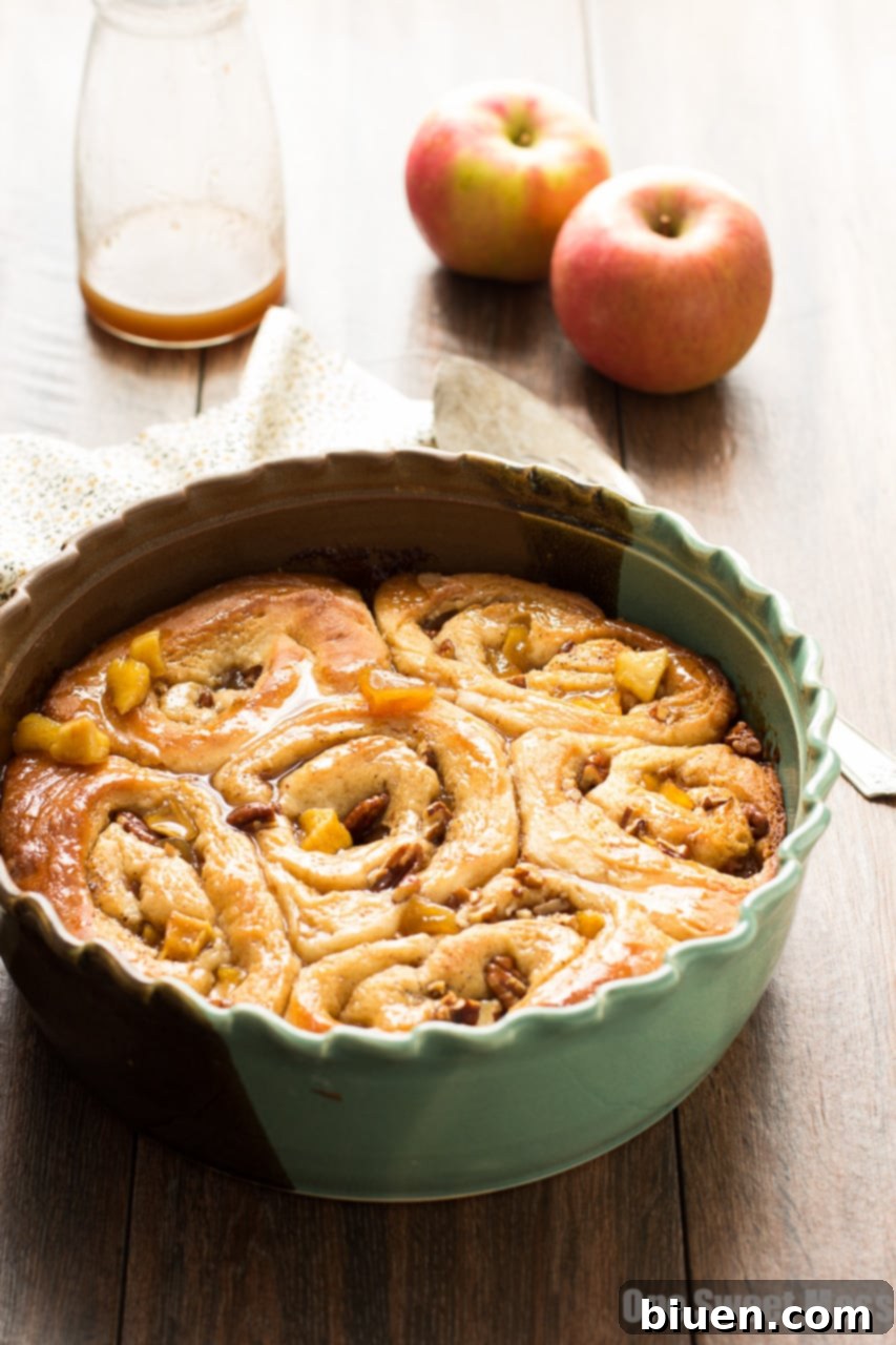 Caramel Apple Cinnamon Rolls, fresh from the oven, oozing with caramel