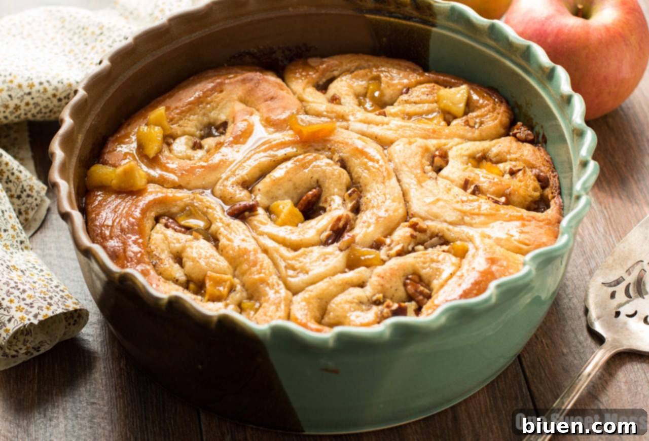 Freshly sliced caramel apple cinnamon rolls ready for baking