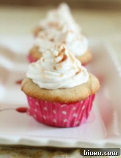 Finished Caramel Stuffed Snickerdoodle Cupcakes on a plate.
