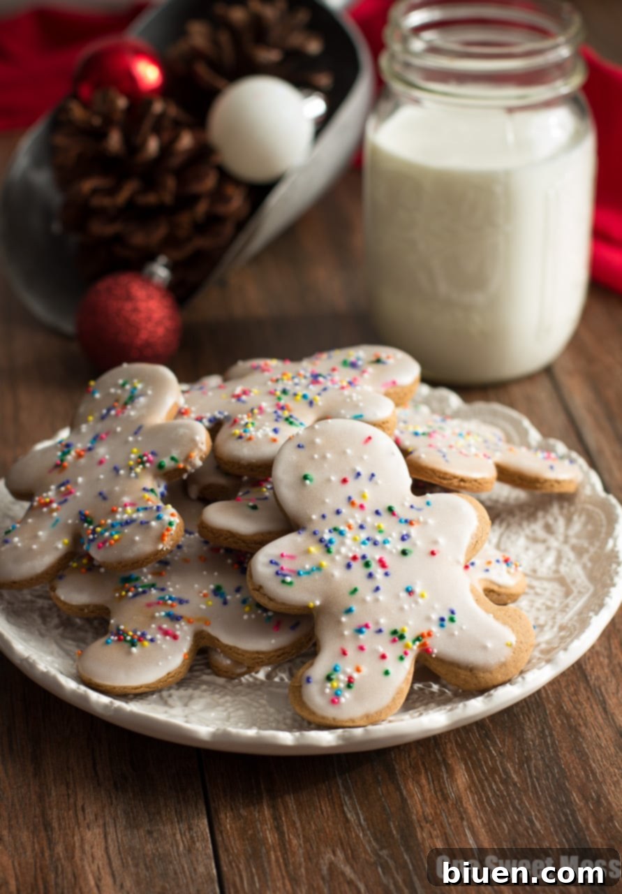 Delicious Glazed Gingerbread Men cookies, beautifully decorated with sprinkles, perfect for holiday gatherings.