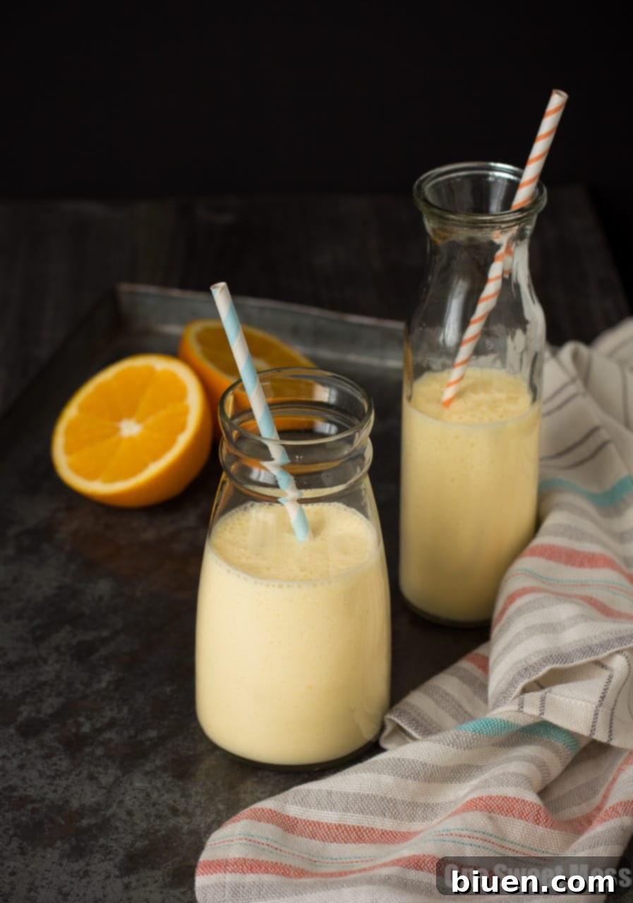 Dreamsicle Smoothie | This orange and vanilla-infused smoothie is ultra thick, rich in protein, and super healthy.